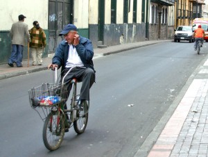 Old man on bike in Bogotá by Nico Crisafulli