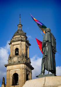 Simon Bolivar holds a gay pride flag in Bogotá