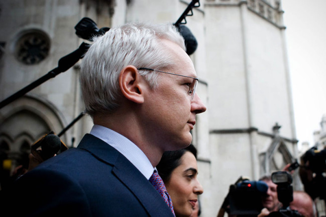 Julian Assange leaves a court house in London.