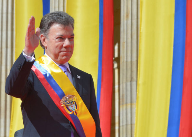 Santos wears the presidential sash during this inauguration.