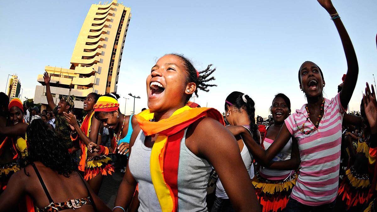 Colombians dance champeta, a musical style influenced by African sounds.