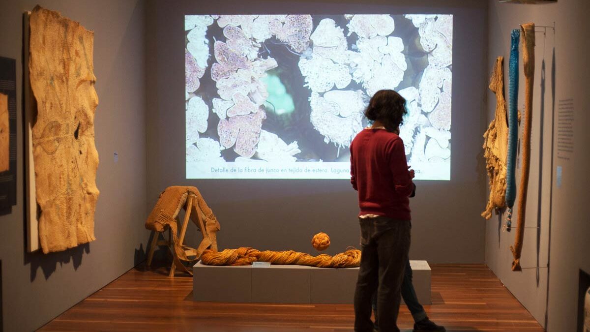 Visitors explore the Pura Fibra exhibition at Colombia's Museo Nacional.
