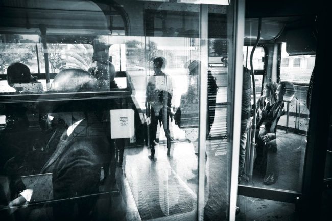A TransMilenio bus pulls away from the station in Bogotá.