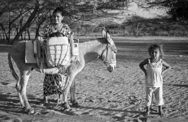 A Wayúu mother and child pose in Colombia's La Guajira region. (Photo by Camilo George)