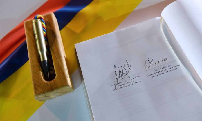 Colombia's signed peace agreement rests next to the bullet pen used to sign it. (Photo courtesy Presidencia de la Republica)