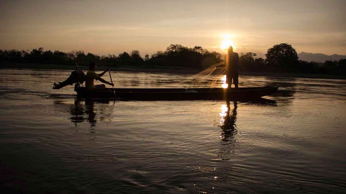 Fishermen cast their nets in the Magdalena River near Colombia's Tatacoa Desert