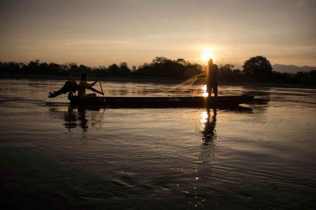Fishermen cast their nets in the Magdalena River near Colombia's Tatacoa Desert