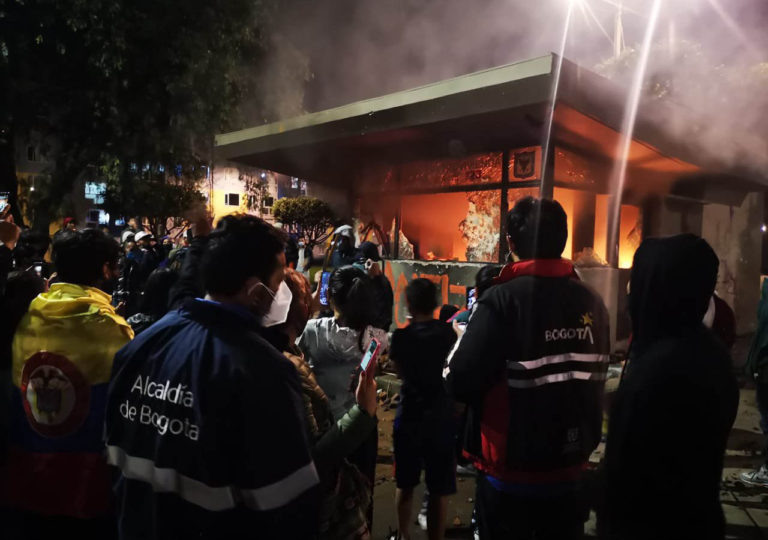 Vandals attempt to burn 15 police officers trapped in Bogotá riots
