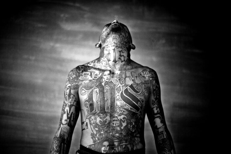 A member of the Mara Salvatrucha gang displays his tattoos inside the Chelatenango prison in El Salvador. Photo: Moisen Saman/Sony World Photography Award.