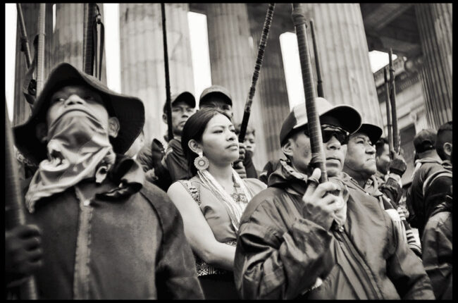 Members of Colombia's Indigenous Guard occupy the steps of Congress in a defiant act after President Petro warned lawmakers that should government reforms be limited there could be "revolution." Photo: Richard Emblin