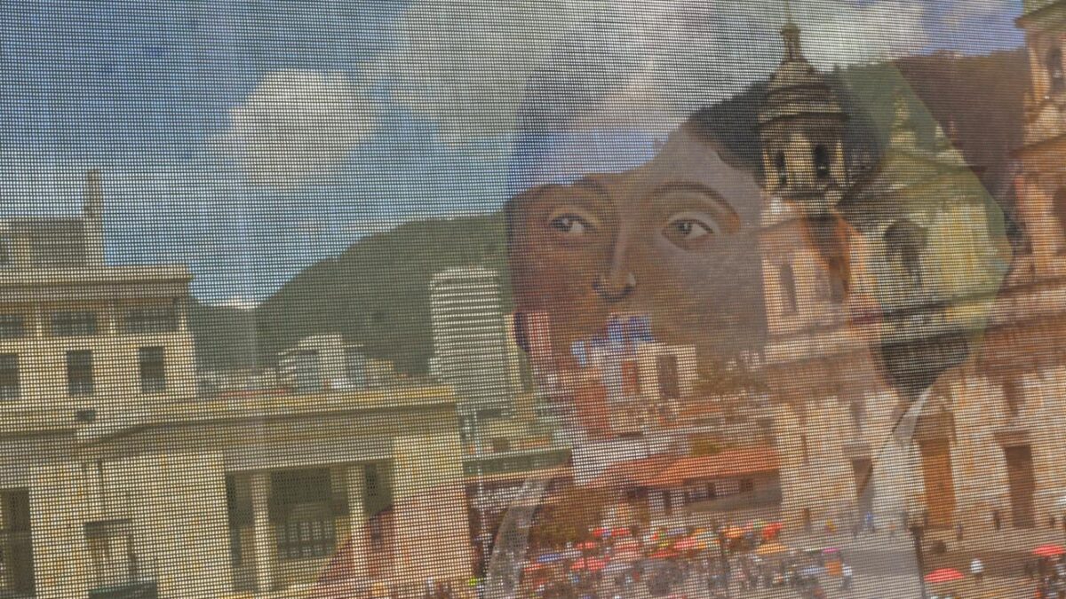 A giant canvas with works by artist Fernando Botero was suspended from the Colombian Congress to mark the funeral ceremony of the world-famous artist. Photo: Richard Emblin